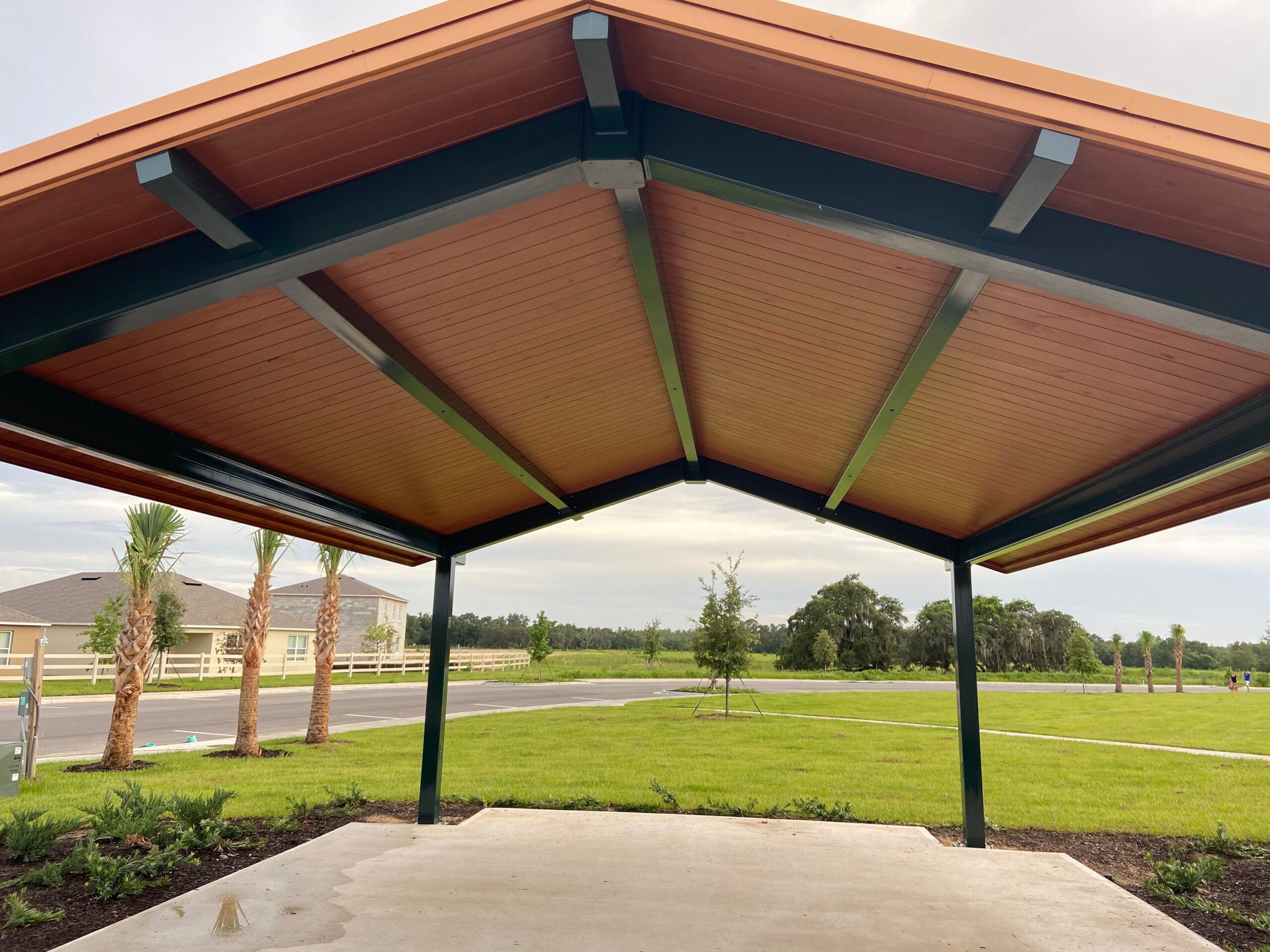 Finished commercial wood staining on Central Florida park pavilion with mahogany stain by Third Coat