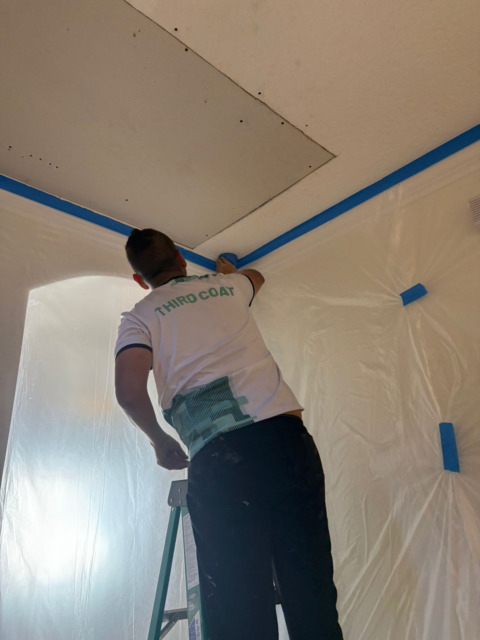 New drywall sheet installation on ceiling by Third Coat technician. Orlando, FL