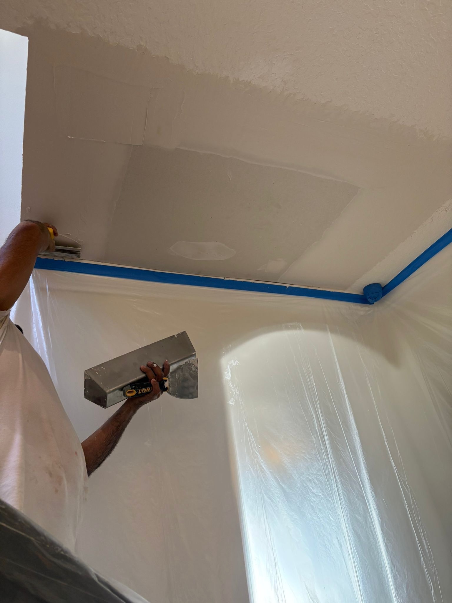 Drywall mud and joint compound application with DeWalt trowel. Third Coat Orlando
