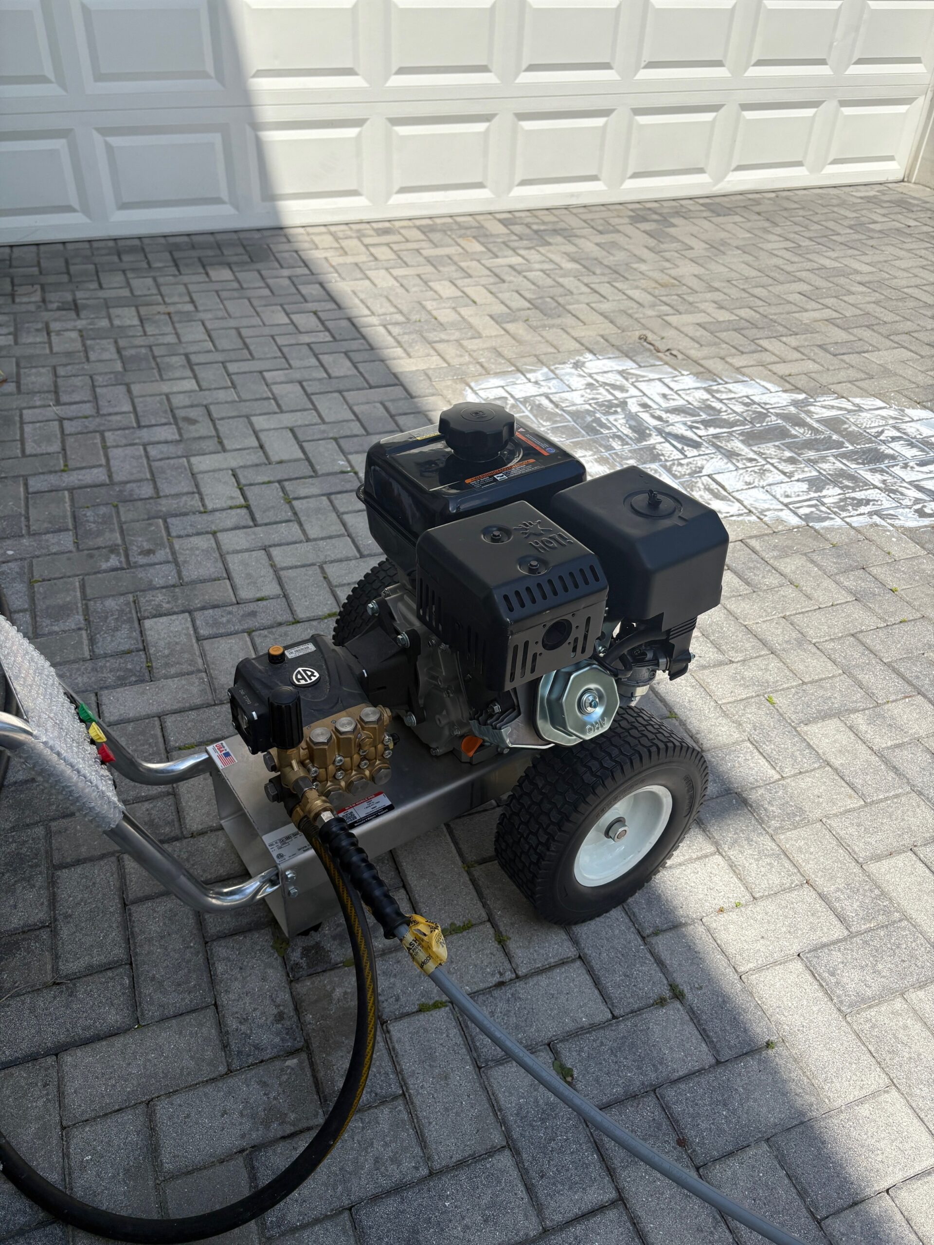 Professional gas-powered pressure washer with AR pump used by Third Coat