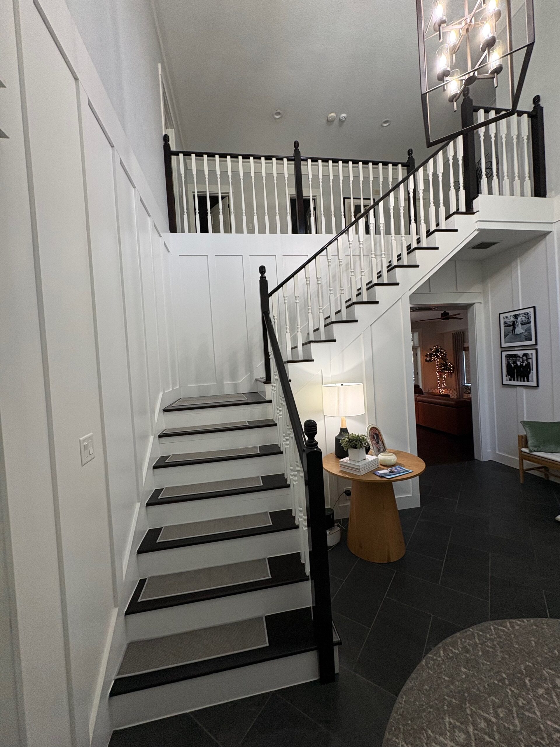 Top view of stained wood staircase with beadboard balusters. Third Coat Orlando